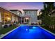 Backyard view of the pool with integrated spa and outdoor living space at 1001 S Oregon Ave, Tampa, FL 33606