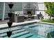The backyard patio offers a comfortable seating area next to the pool at 1001 S Oregon Ave, Tampa, FL 33606