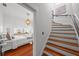 View of staircase with wood steps and white risers, leading to a bedroom at 1001 S Oregon Ave, Tampa, FL 33606