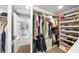 Well-organized walk-in closet with built-in shelves and storage, connects to bathroom at 1001 S Oregon Ave, Tampa, FL 33606