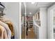Spacious walk-in closet featuring custom shelving and drawers for optimal storage in a well-lit space at 1001 S Oregon Ave, Tampa, FL 33606