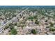 A sprawling residential area with many homes, tree-lined streets, and a busy thoroughfare cutting through the scene at 1005 Cameo Crest Ln, Valrico, FL 33596