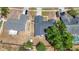 Aerial view of the house, highlighting the roof, neighboring properties, and large tree in the backyard at 1005 Cameo Crest Ln, Valrico, FL 33596
