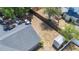 Aerial view of the fenced backyard showing the chimney, storage shed, and treed lot at 1005 Cameo Crest Ln, Valrico, FL 33596