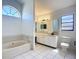 Bright bathroom with soaking tub, and dual-sink vanity at 1005 Cameo Crest Ln, Valrico, FL 33596