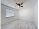 Well-lit bedroom featuring a modern ceiling fan and a window at 1005 Cameo Crest Ln, Valrico, FL 33596