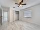 Bright bedroom with stylish ceiling fan, and marble-look flooring at 1005 Cameo Crest Ln, Valrico, FL 33596