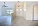 Welcoming foyer features modern flooring, a stylish light fixture, and a view into the living space at 1005 Cameo Crest Ln, Valrico, FL 33596