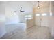 Inviting foyer with double doors, modern flooring, and seamless transition to the living area at 1005 Cameo Crest Ln, Valrico, FL 33596