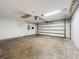 Spacious two-car garage with concrete floors, perfect for storage and parking at 1005 Cameo Crest Ln, Valrico, FL 33596