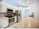 Bright eat-in kitchen with stainless steel appliances, a mosaic tile backsplash, and lots of counter space at 1005 Cameo Crest Ln, Valrico, FL 33596