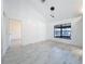 Bright living room with modern light fixtures and large windows offers style and natural light at 1005 Cameo Crest Ln, Valrico, FL 33596