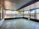 Enclosed patio with patterned floors and screened walls, perfect for outdoor living at 1005 Cameo Crest Ln, Valrico, FL 33596