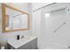 Bathroom features a shower and vanity at 10442 Cirimoya Ln, Seminole, FL 33772