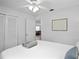 Bedroom with wall art above the headboard at 10442 Cirimoya Ln, Seminole, FL 33772