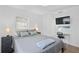 Inviting bedroom includes a desk, TV, and bedside tables at 10442 Cirimoya Ln, Seminole, FL 33772