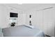 Bright bedroom featuring a desk and closet space at 10442 Cirimoya Ln, Seminole, FL 33772