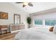 Bright main bedroom featuring large windows, hardwood floors, and accent furniture at 1050 Starkey Rd # 2205, Largo, FL 33771