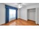 Bedroom featuring hardwood floors, a ceiling fan, and a closet at 111 W Anglewood Dr, Brandon, FL 33511
