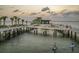 Scenic pier view at sunset with palm trees and clear water at 1120 N Shore Ne Dr # 201, St Petersburg, FL 33701