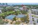Scenic aerial view highlighting community amenities with tennis courts and green space at 1120 North Shore Ne Dr # 201, St Petersburg, FL 33701