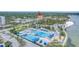 Aerial view featuring a large swimming pool complex, neighborhood, and waterfront location at 1120 N Shore Ne Dr # 201, St Petersburg, FL 33701