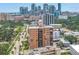 A high-rise building in an urban setting with city skyline views and lush green trees at 1120 N Shore Ne Dr # 201, St Petersburg, FL 33701