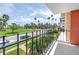 A lovely balcony view overlooking the street, green space and many palm trees at 1120 North Shore Ne Dr # 201, St Petersburg, FL 33701