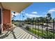 Serene balcony with seating and scenic views of palm trees, and lush landscaping at 1120 N Shore Ne Dr # 201, St Petersburg, FL 33701