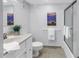 Clean bathroom featuring tile floors, a modern vanity, and a glass-enclosed shower at 1120 N Shore Ne Dr # 201, St Petersburg, FL 33701