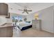 Inviting bedroom with a work desk, comfortable bed, and a bright window view at 1120 N Shore Ne Dr # 201, St Petersburg, FL 33701