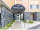 Building entrance with textured stone accents and inviting landscaping welcoming residents and guests at 1120 N Shore Ne Dr # 201, St Petersburg, FL 33701