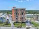 A full exterior view of a modern building with balconies and a well-maintained lawn at 1120 N Shore Ne Dr # 201, St Petersburg, FL 33701