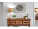 Foyer featuring a distressed console table adorned with stylish accents and unique wood-ring art at 1120 N Shore Ne Dr # 201, St Petersburg, FL 33701