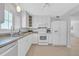 Well-equipped kitchen with modern appliances, ample cabinet space, and tile flooring at 1120 N Shore Ne Dr # 201, St Petersburg, FL 33701