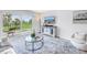 Living room showcasing stylish decor and a balcony view with sliding glass doors at 1120 North Shore Ne Dr # 201, St Petersburg, FL 33701