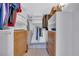 Spacious walk-in closet with built-in shelving and ample storage for clothes and accessories at 1120 North Shore Ne Dr # 201, St Petersburg, FL 33701