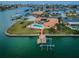 Beautiful waterfront home with a private dock, pool, and tropical landscaping at 11625 5Th E St, Treasure Island, FL 33706