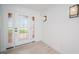 Bright foyer with tiled flooring and an elegant front door and transom at 11625 5Th E St, Treasure Island, FL 33706