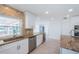 Updated kitchen with brick backsplash, wine cooler, and stainless steel appliances at 11625 5Th E St, Treasure Island, FL 33706
