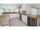 Bright kitchen with stainless appliances, granite countertops, wine cooler and tile backsplash at 11625 5Th E St, Treasure Island, FL 33706