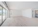 Large open living space with tile floors and sliding glass doors leading to water views at 11625 5Th E St, Treasure Island, FL 33706