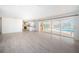 Open living space with views of lanai, pool, and access to a modern kitchen at 11625 5Th E St, Treasure Island, FL 33706