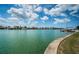 Scenic waterfront view showing calm canal water, lush green landscape, boat docks and residential community homes at 11625 5Th E St, Treasure Island, FL 33706