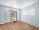 Bright bedroom with wood floors, large sliding glass door and window providing lots of natural light at 11807 Raintree Lake Ln # B, Tampa, FL 33617