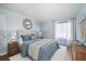 Serene bedroom with a cozy bed and soft, neutral decor at 11807 Raintree Lake Ln # B, Tampa, FL 33617