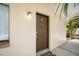Exterior door to condo with 'B' marking and adjacent exterior light at 11807 Raintree Lake Ln # B, Tampa, FL 33617