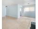 Spacious living room with tiled floors and abundant natural light at 11807 Raintree Lake Ln # B, Tampa, FL 33617