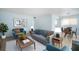 Stylishly furnished living room featuring a sofa, accent chairs, and dining area at 11807 Raintree Lake Ln # B, Tampa, FL 33617