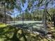 Outdoor tennis court is surrounded by chain link fence in this community at 11807 Raintree Lake Ln # B, Tampa, FL 33617